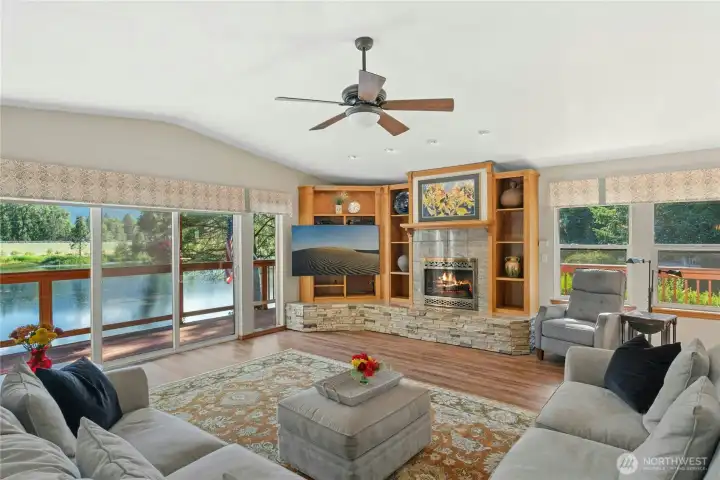 Walls of windows fill the great room with natural light while showcasing beautiful water views. Walls of windows fill the great room with natural light while showcasing beautiful water views.