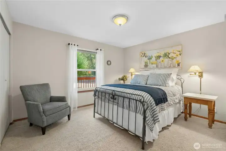 Wake up to nature in this beautiful bedroom framed by lush green views just beyond the window. Wake up to nature in this beautiful bedroom framed by lush green views just beyond the window.