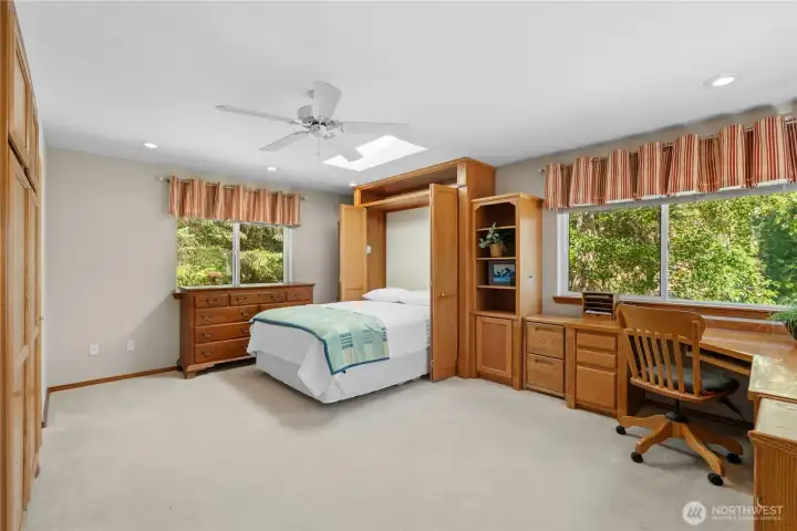A versatile office with a Murphy bed and extensive built-in storage easily adapts to changing needs. A versatile office with a Murphy bed and extensive built-in storage easily adapts to changing needs.