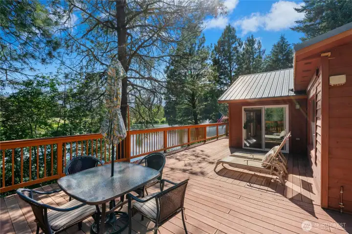 Enjoy seamless indoor-outdoor living with an expansive entertaining deck overlooking the grounds. Enjoy seamless indoor-outdoor living with an expansive entertaining deck overlooking the grounds.
