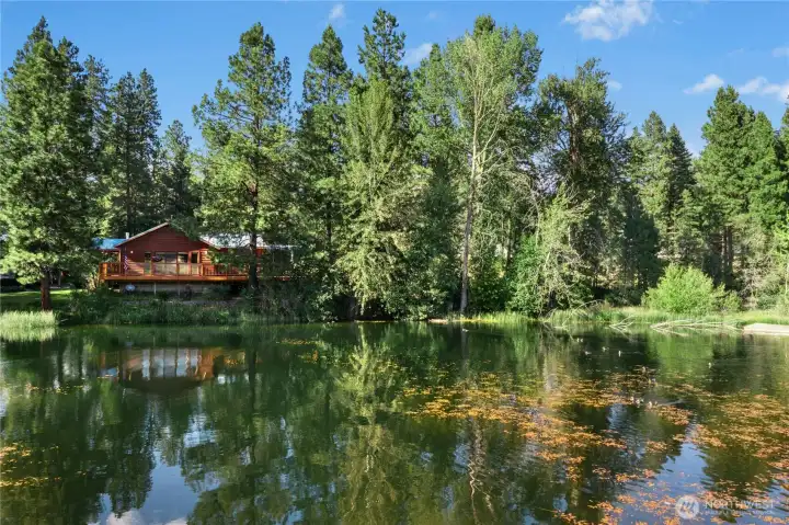 From across the lake, the home's timeless Northwest architecture and extraordinary setting are fully revealed. From across the lake, the home's timeless Northwest architecture and extraordinary setting are fully revealed.