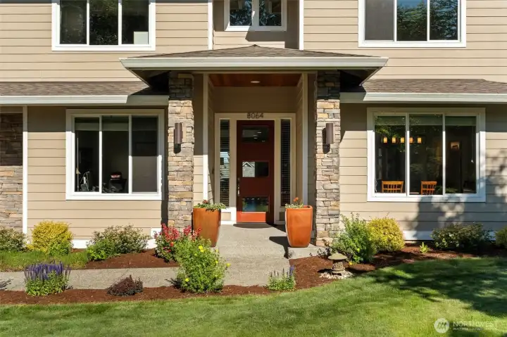 Covered entry showcases attractive architectural details and a landscaped approach to the front door. Covered entry showcases attractive architectural details and a landscaped approach to the front door.