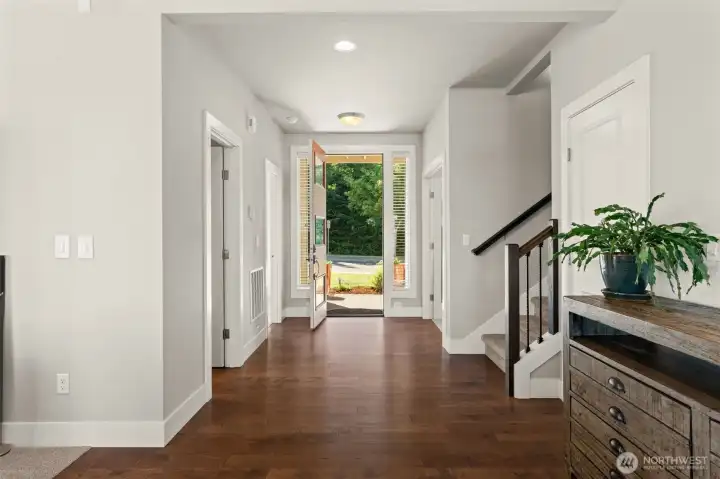 Open foyer with hardwood flooring creates a comfortable arrival and seamless flow throughout the home. Open foyer with hardwood flooring creates a comfortable arrival and seamless flow throughout the home.