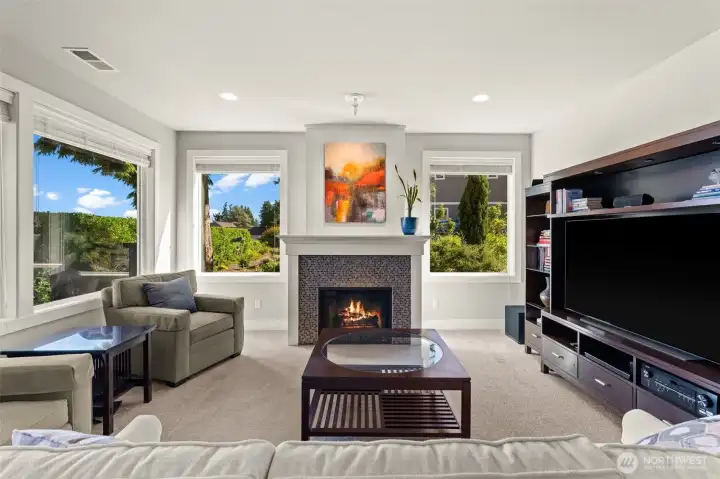 The living room features a gas fireplace, abundant windows, and a layout designed for relaxing and entertaining. The living room features a gas fireplace, abundant windows, and a layout designed for relaxing and entertaining.