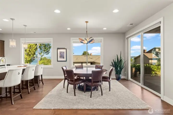Dining space features large windows, an open-concept design, and direct access to the covered deck. Dining space features large windows, an open-concept design, and direct access to the covered deck.