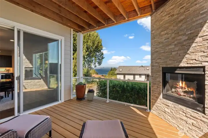 Covered deck features an outdoor fireplace and provides a comfortable space for year-round enjoyment. Covered deck features an outdoor fireplace and provides a comfortable space for year-round enjoyment.