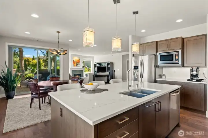 Generous cabinetry and a large center island provide exceptional storage and prep space for everyday cooking. Generous cabinetry and a large center island provide exceptional storage and prep space for everyday cooking.