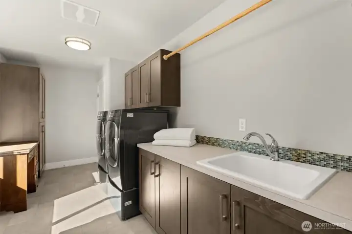 Oversized laundry room with ample storage. Oversized laundry room with ample storage.