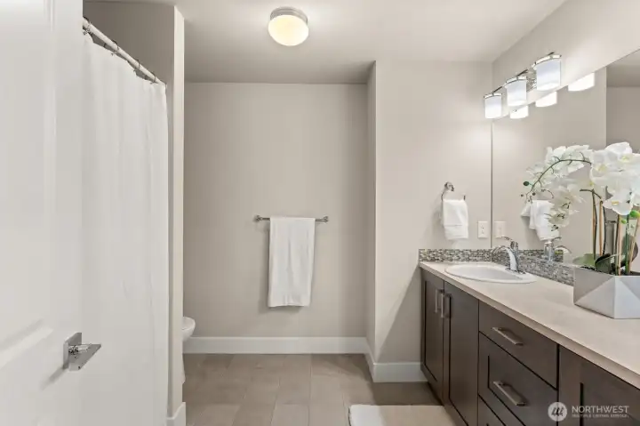 Thoughtfully designed full bathroom features a spacious vanity with generous counter space, abundant storage, and a tub/shower combination. Thoughtfully designed full bathroom features a spacious vanity with generous counter space, abundant storage, and a tub/shower combination.