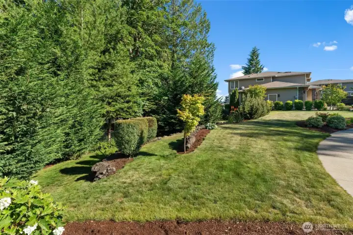 Beautifully maintained grounds feature mature trees, manicured lawn areas, and thoughtfully designed landscaping. Beautifully maintained grounds feature mature trees, manicured lawn areas, and thoughtfully designed landscaping.