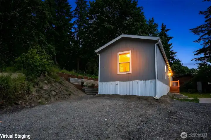 Virtually staged twilight photo of the home with parking in front Virtually staged twilight photo of the home with parking in front