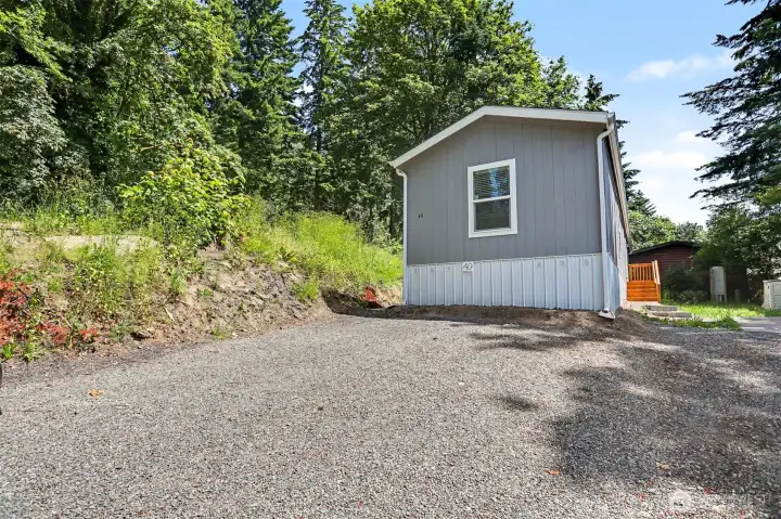 Front of home showing parking without virtual staging Front of home showing parking without virtual staging