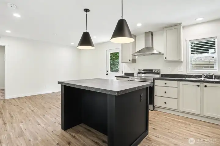 Kitchen with living space in the background without virtual staging Kitchen with living space in the background without virtual staging