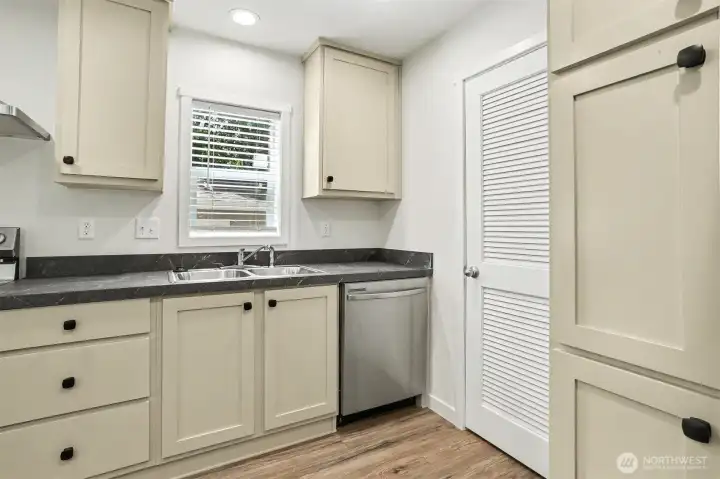 Enjoy brand new appliances and cabinets in this beautiful kitchen! Laundry room door is to the right of the dishwasher Enjoy brand new appliances and cabinets in this beautiful kitchen! Laundry room door is to the right of the dishwasher