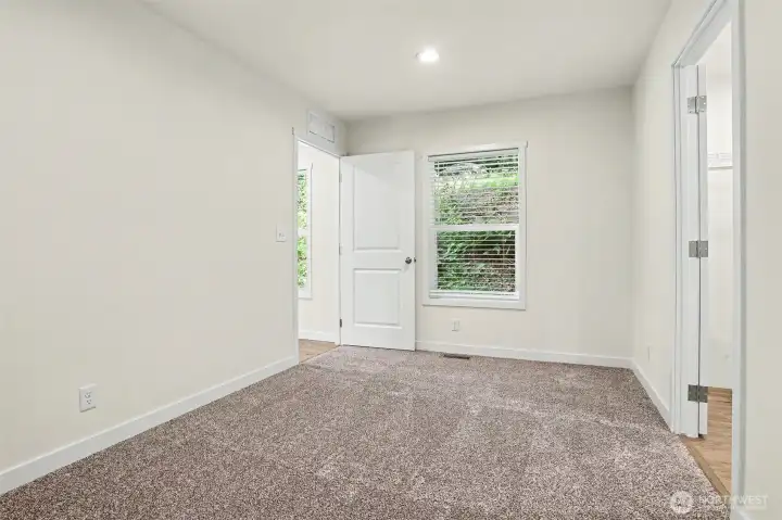 View of the primary bedroom door with en suite bath and walk-in closet to the right View of the primary bedroom door with en suite bath and walk-in closet to the right