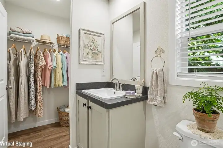 Virtually staged primary bedroom en suite bath and walk-in closet Virtually staged primary bedroom en suite bath and walk-in closet
