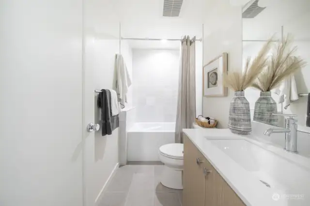 Lower level bathroom provides for independent guest suite