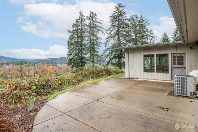 Back patio (accessed from the Primary bedroom and thru the Dutch door in current dining area).  Across the way is the Cowlitz River and parts of Kelso