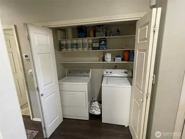 Laundry room with extra storage.
