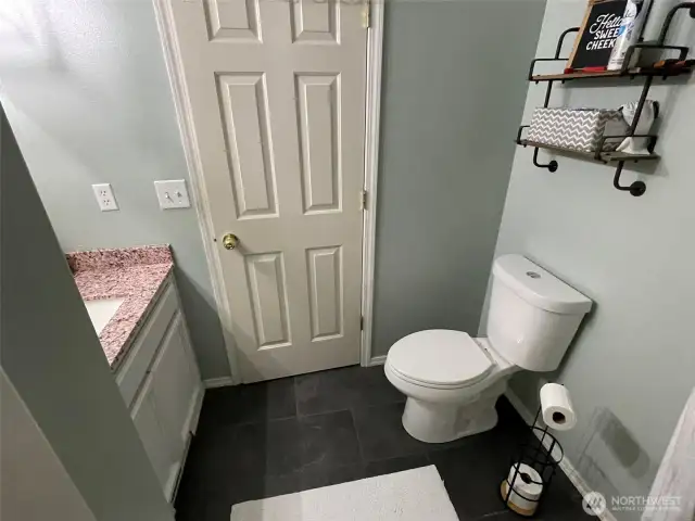 Full bathroom in hallway by 2nd bedroom.