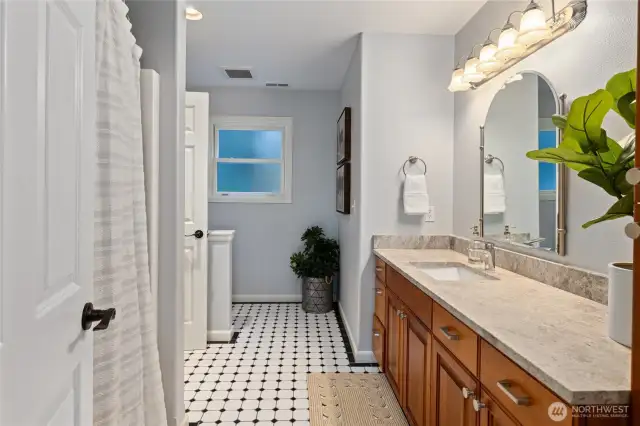 1 of 2 upstairs bathrooms that connects to bedroom as well as hallway.