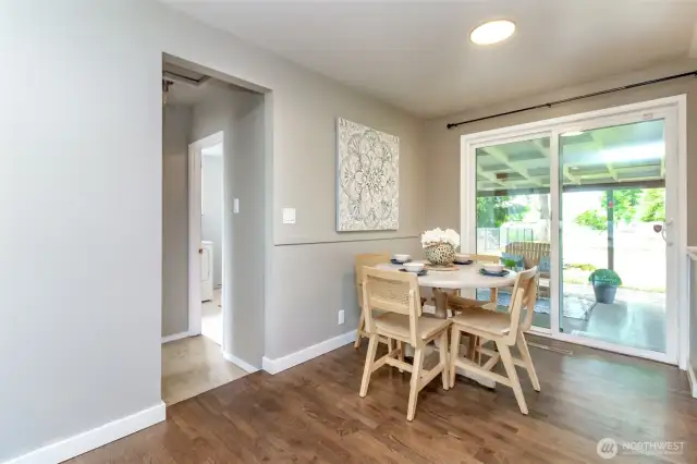 Dining room off of the kitchen and sliding glass door leads to the fully covered patio and fully fenced back yard..