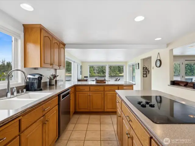 Gorgeous Kitchen w/ view, large Island, lots of counter space & storage galore with so many cabinets.