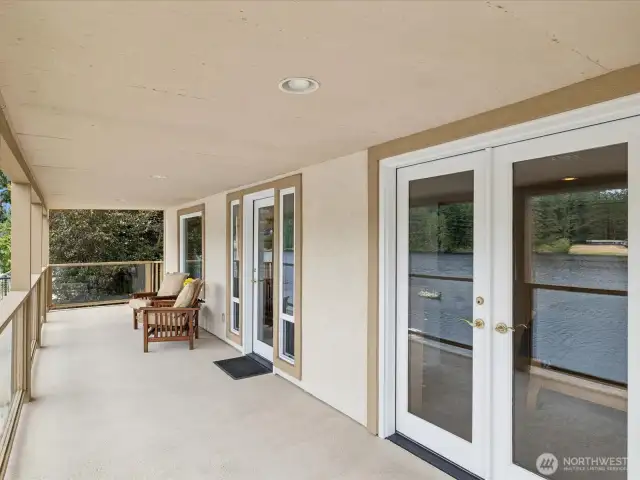 Primary Bedroom has French Doors leading out to large Deck with great Lake view!