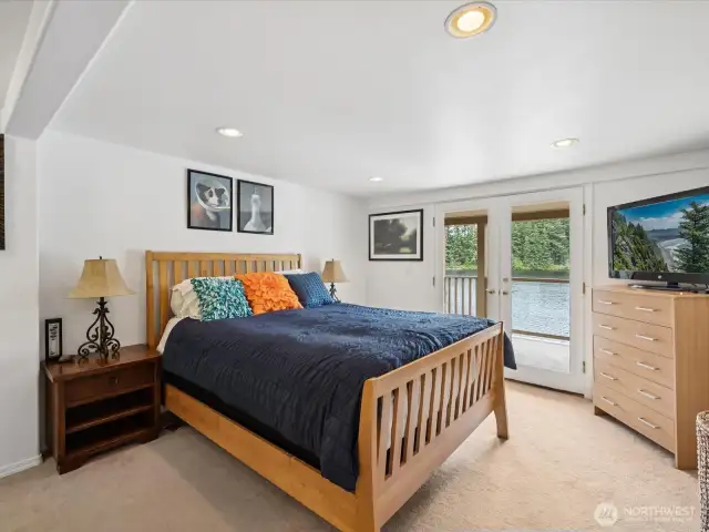 Lower level Primary Suite with lovely full bathroom, dual-headed shower & large soaking tub.