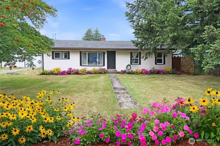 Double lot offers room to roam—enjoy extra space for gardening, hobbies, or simply  relaxing.