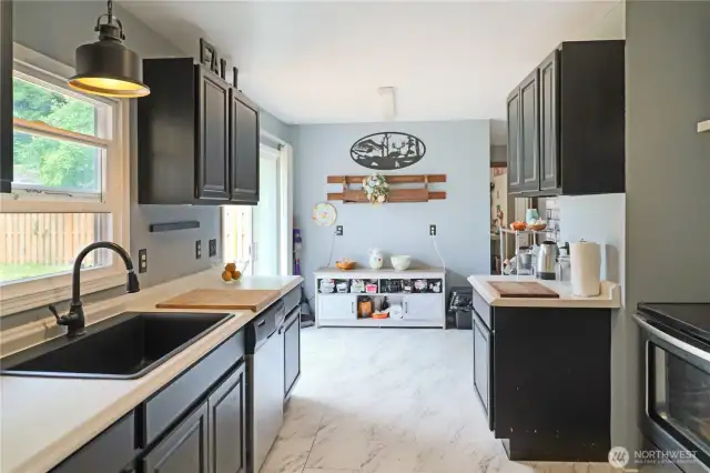 Updated kitchen with new stainless-steel refrigerator and sleek modern finishes—ready  for your next culinary adventure.