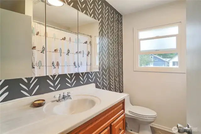 Functional main bathroom with full tub/shower combo and room to refresh.