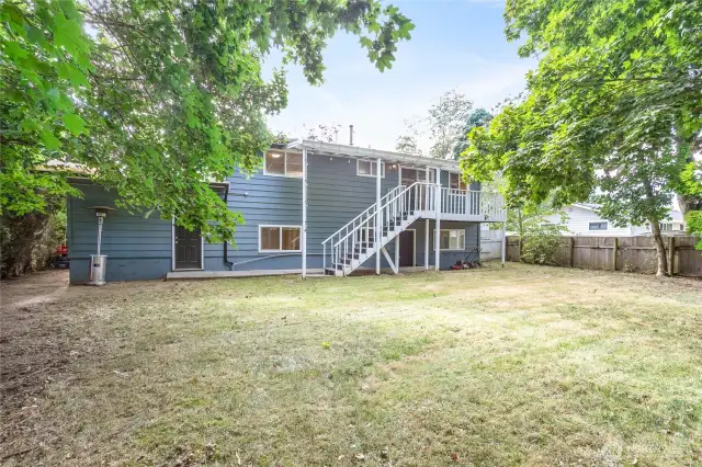 Direct access to garage through brown door. Notice huge yard, cherry trees & fully fenced