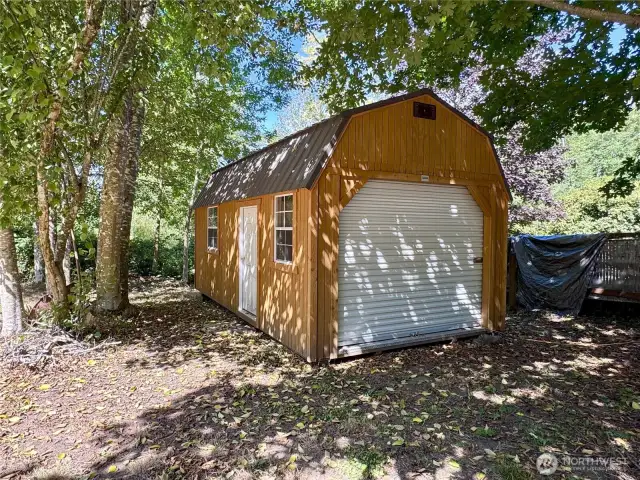 First of two outbuildings, a new large shed built on a concrete slab.