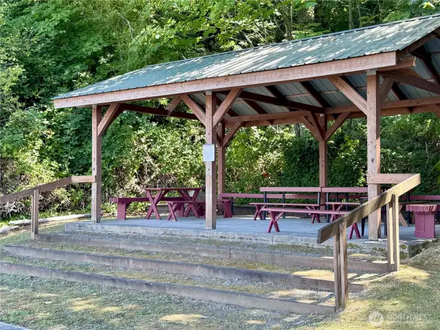 The beach has a picnic shelter for all residents to enjoy.