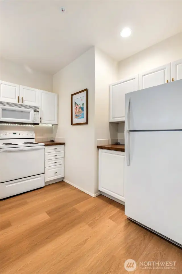 All the kitchen appliances stay with the home. New LVP flooring is ideal in a kitchen (water-proof material)