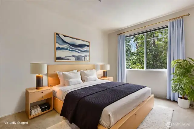 The primary suite offers greenbelt views, two closets (lite walk-in closet is large), and private tile bath