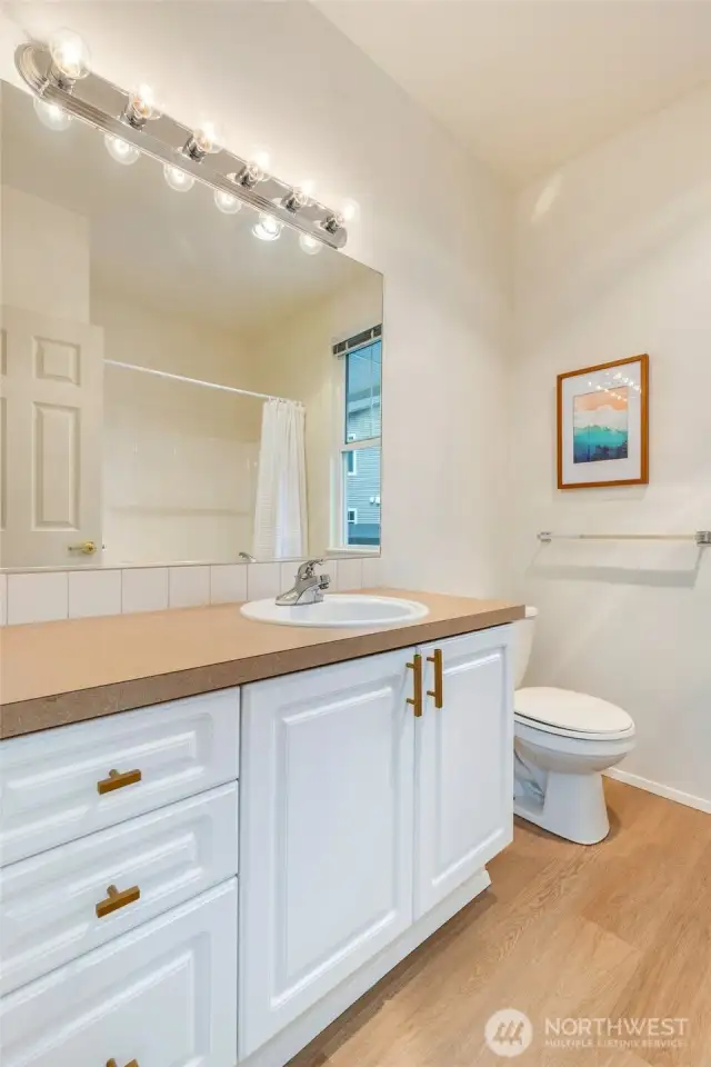 Hall bath with new LVP flooring.
