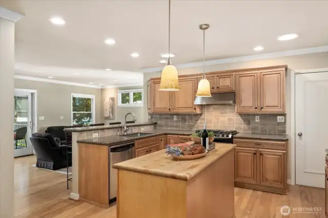 Kitchen connected to informal living and covered deck