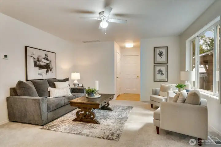 Bright and welcoming—main floor living and family rooms flow seamlessly from the kitchen to the private backyard.