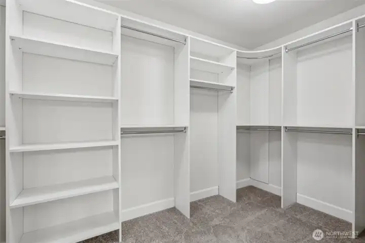 Primary bedroom walk-in closet