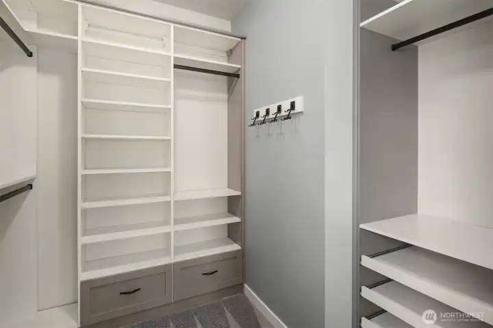 primary closet has closet organizer
