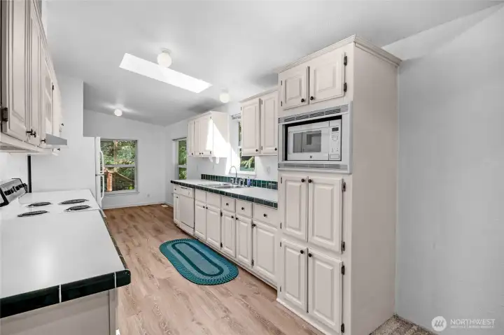 Spacious kitchen with new LVP flooring.