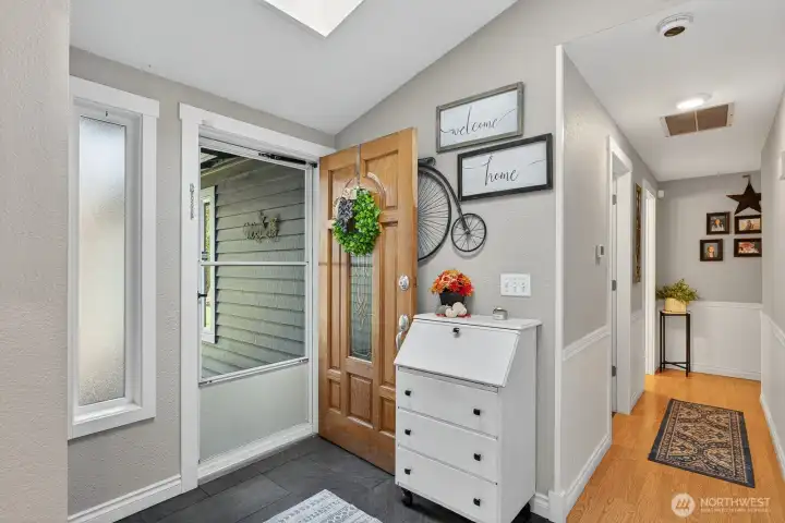 Slate flooring in the entry way & skylight Making an inviting entry. The interior was painted in 2023 and nice fresh colors.