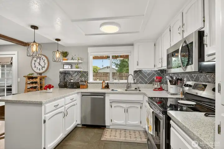 Another angle of the kitchen showing the slate tile floor.  Cabinets were recently painted as well.