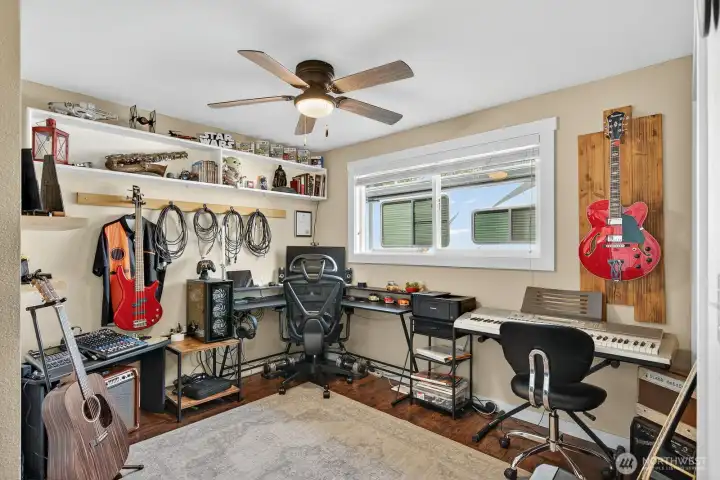 Bedroom #3 is currently being used as a music room.  There is a closet and blinds on the windows.
