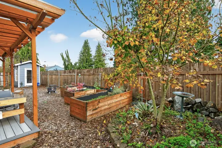 Garden shed for yard tools and potting place.