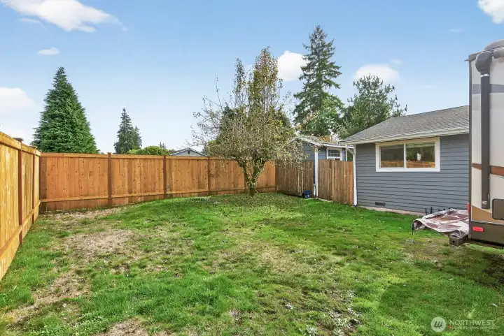 There is a pear tree and an apple tree as well.  The roof is approximately 7 years old.