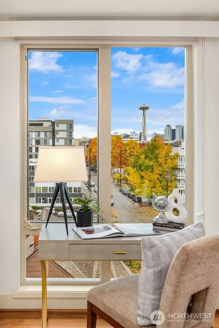 Who doesn't want to work or study from here?!  Second bedroom, the Space Needle and bountiful trees and views of nature perfectly framed by the window!