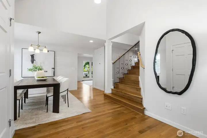 High ceiling entrance, updated staircase and hardwood floors